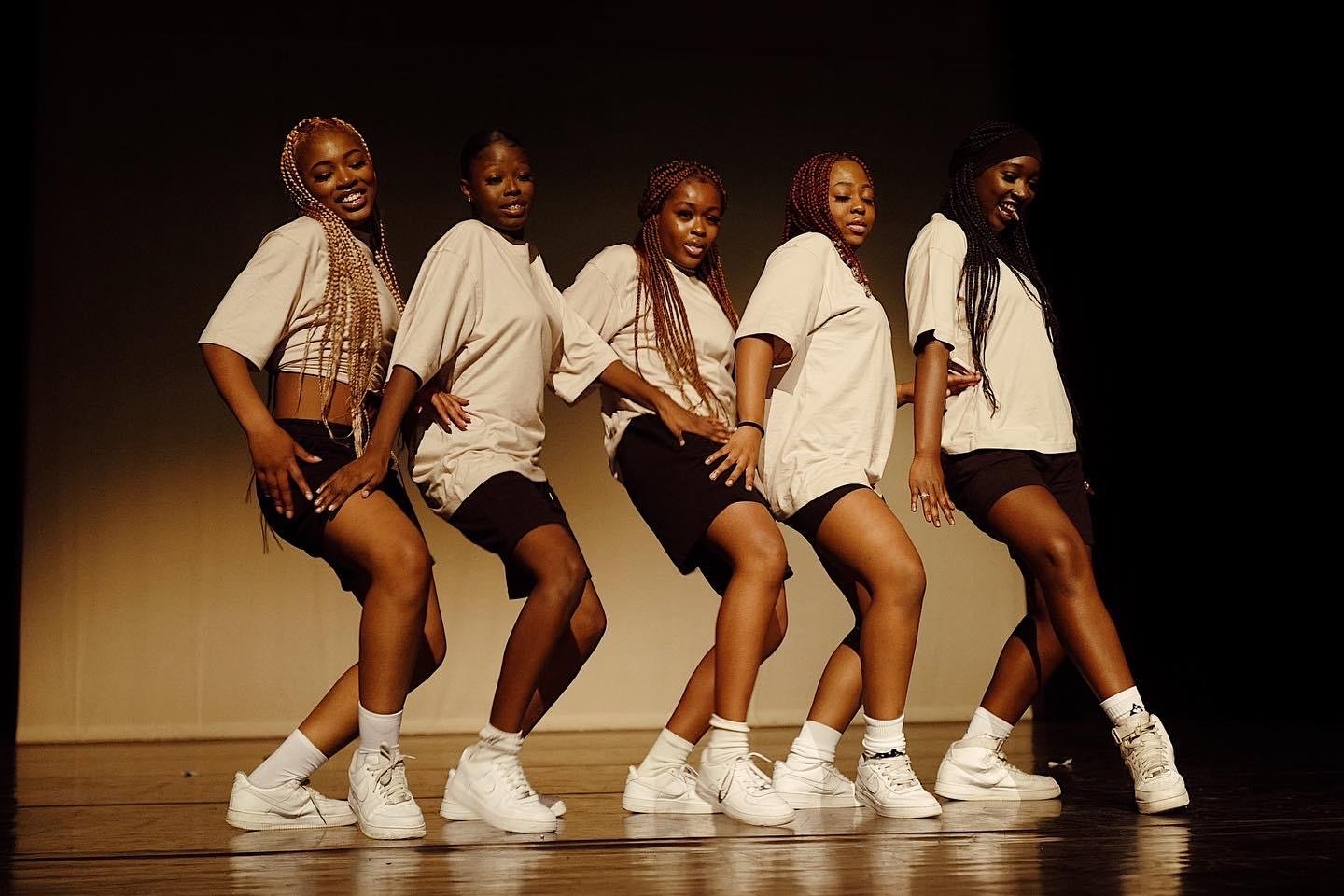5 girls dancing in a white t-shirt 